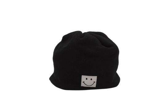 Black beanie with a white smiley face logo on a light gray background